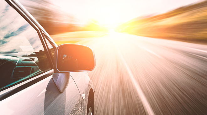 Car ride on road in sunny weather